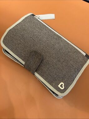 Compact Diaper Holder with Changing Pad. Quick for on the go!